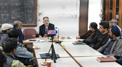 American physicist, Dr. Brian Greene interacting with the faculty and staff